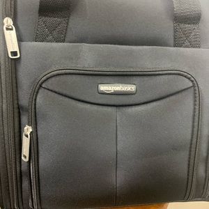 Amazon Basics black under seat roller bag